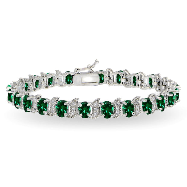 Sterling Silver Created Emerald 6x4mm Oval and S Tennis Bracelet with White Topaz Accents