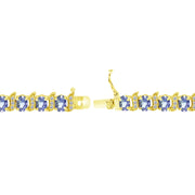 Yellow Gold Flashed Sterling Silver Tanzanite 6x4mm Oval and S Tennis Bracelet with White Topaz Accents