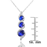 Sterling Silver Created Blue Sapphire and White Topaz Oval S Design Three-Stone Journey Necklace