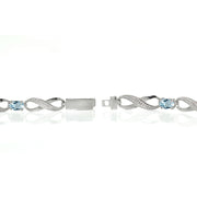 Sterling Silver Blue Topaz and Diamond Accent Infinity Link Bracelet