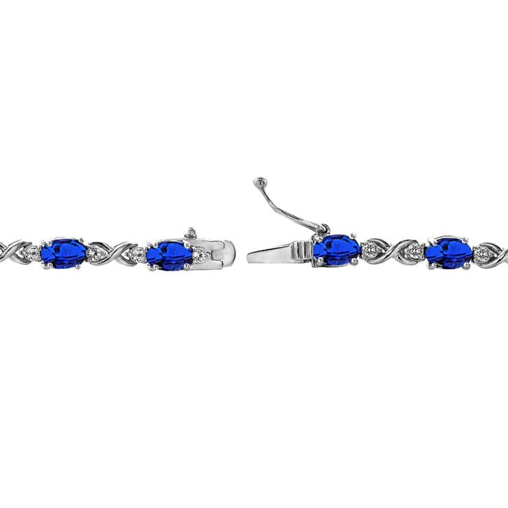 Sterling Silver Created Blue Sapphire 6x4mm Oval Infinity Bracelet with White Topaz Accents