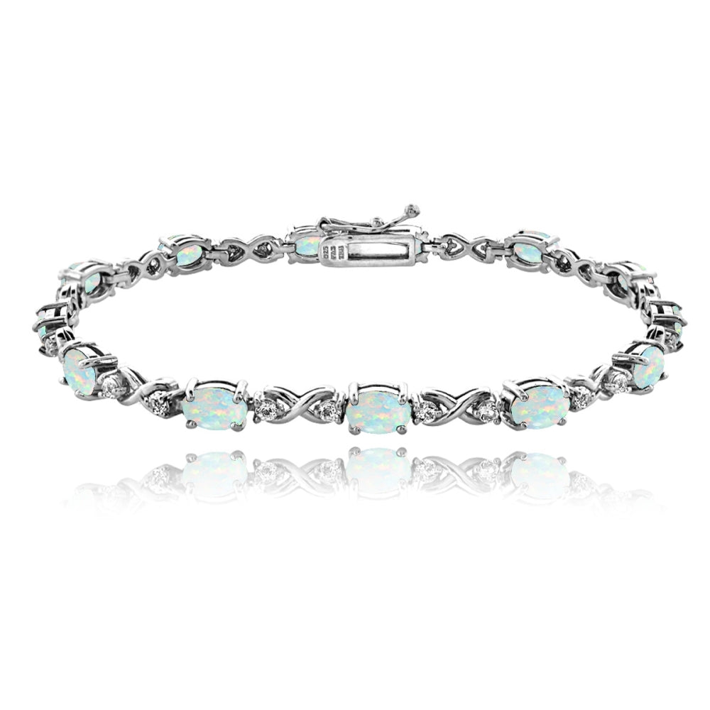 Sterling Silver Created White Opal 6x4mm Oval Infinity Bracelet with White Topaz Accents