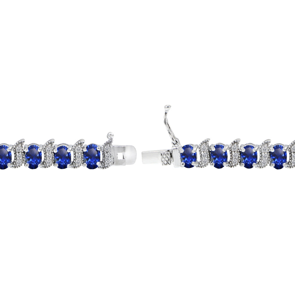 Sterling Silver Created Blue Sapphire 6x4mm Oval and S Tennis Bracelet with White Topaz Accents-2