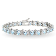 Sterling Silver Blue Topaz 6x4mm Oval and S Tennis Bracelet with White Topaz Accents