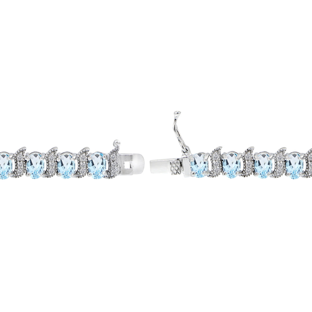 Sterling Silver Blue Topaz 6x4mm Oval and S Tennis Bracelet with White Topaz Accents-2