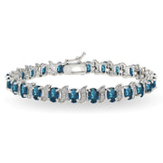 Sterling Silver London Blue Topaz 6x4mm Oval and S Tennis Bracelet with White Topaz Accents