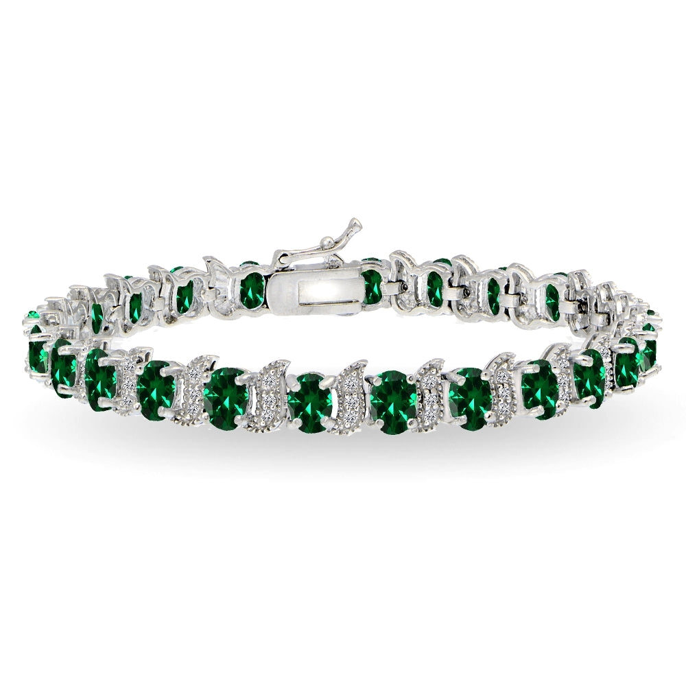 Sterling Silver Created Emerald 6x4mm Oval and S Tennis Bracelet with White Topaz Accents
