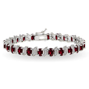 Sterling Silver Created Ruby 6x4mm Oval and S Tennis Bracelet with White Topaz Accents