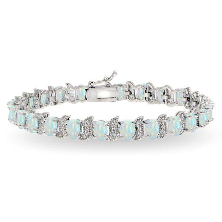 Sterling Silver Created White Opal 6x4mm Oval and S Tennis Bracelet with White Topaz Accents