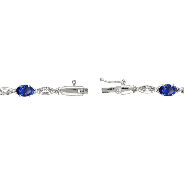 Sterling Silver Created Blue Sapphire and White Topaz Oval-Cut Swirl Tennis Bracelet
