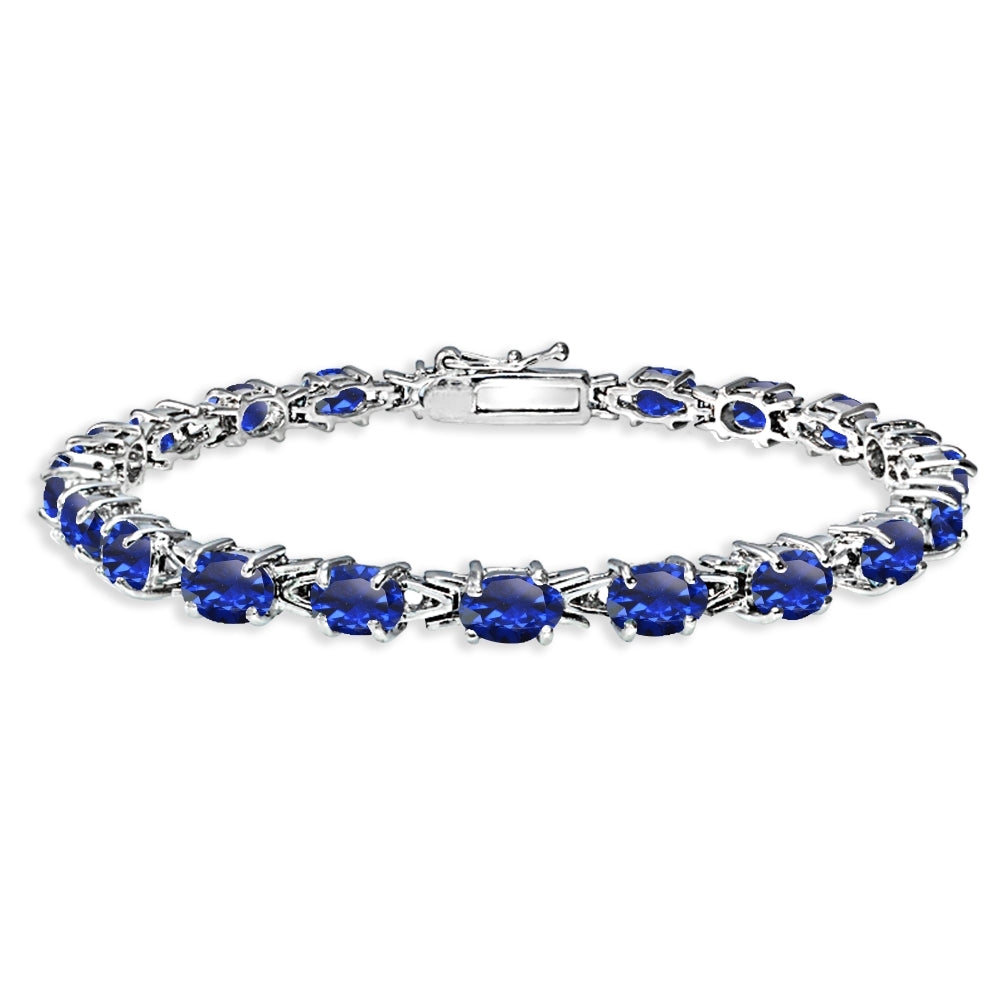 Sterling Silver Polished Created Blue Sapphire 6x4mm Oval-cut Link Tennis Bracelet