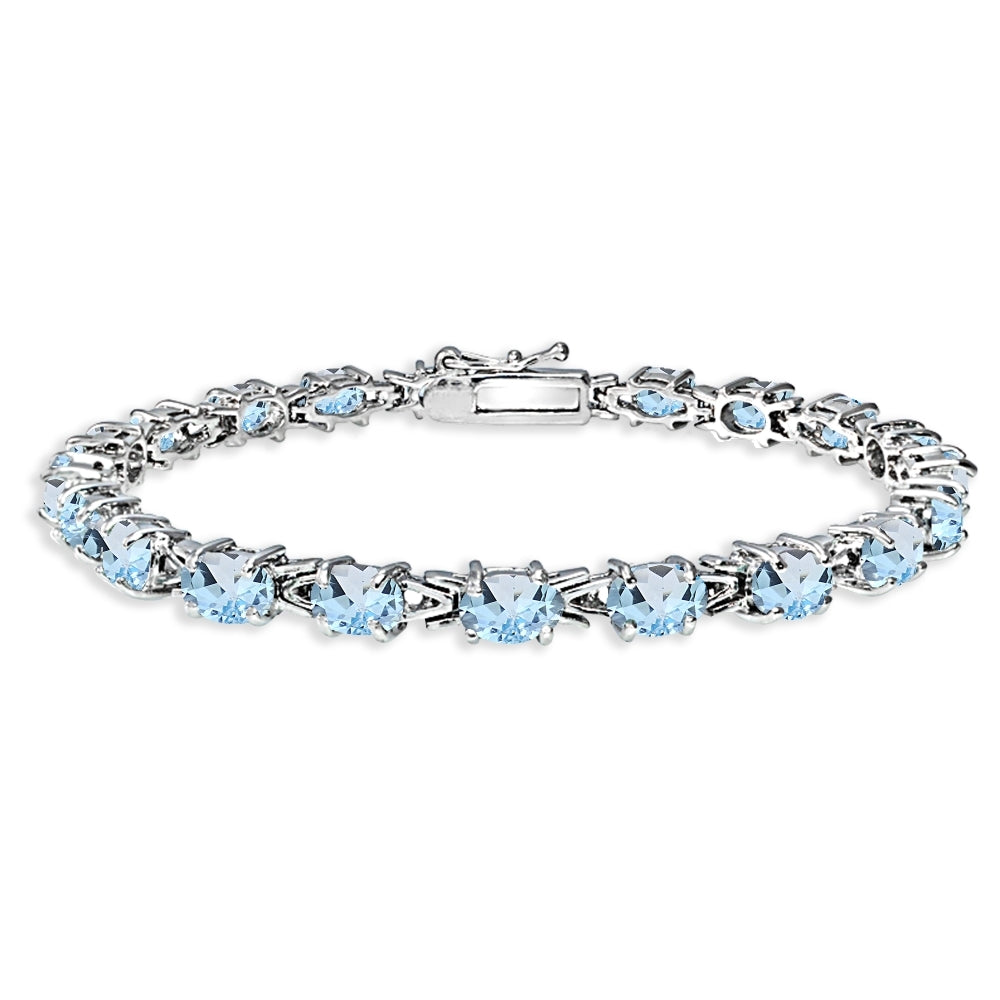 Sterling Silver Polished Blue Topaz 6x4mm Oval-cut Link Tennis Bracelet