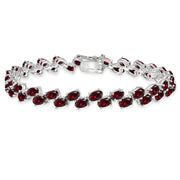 Sterling Silver Created Ruby 5x3mm Oval Wave Tennis Bracelet