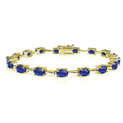 Yellow Gold Flashed Sterling Silver Created Blue Sapphire 6x4mm Oval Classic Link Tennis Bracelet