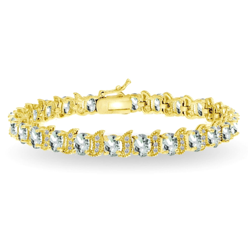 Yellow Gold Flashed Sterling Silver Aquamarine 6x4mm Oval and S Tennis Bracelet with White Topaz Accents