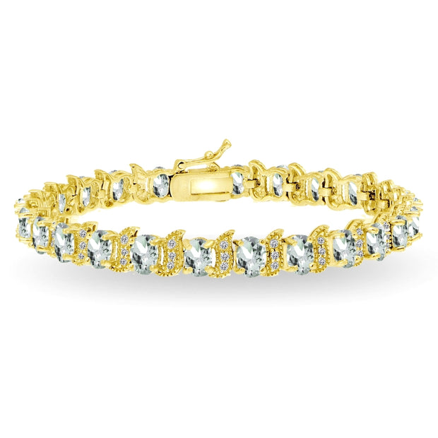 Yellow Gold Flashed Sterling Silver Aquamarine 6x4mm Oval and S Tennis Bracelet with White Topaz Accents