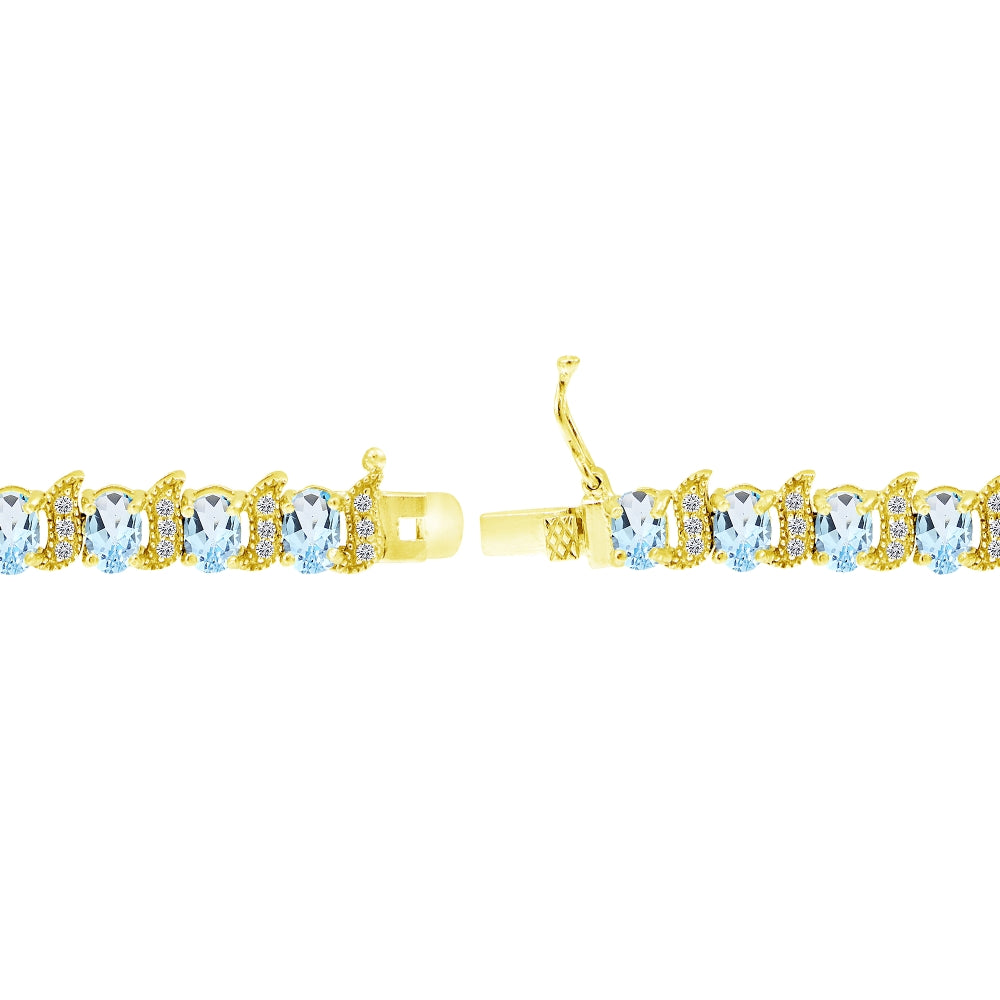 Yellow Gold Flashed Sterling Silver Blue Topaz 6x4mm Oval and S Tennis Bracelet with White Topaz Accents-2