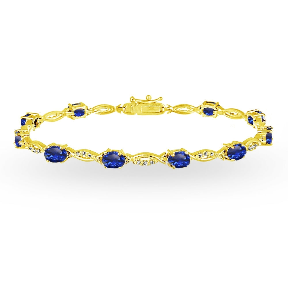Yellow Gold Flashed Sterling Silver Created Blue Sapphire and White Topaz Oval-Cut Swirl Tennis Bracelet