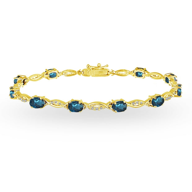 Yellow Gold Flashed Sterling Silver London Blue and White Topaz Oval-Cut Swirl Tennis Bracelet