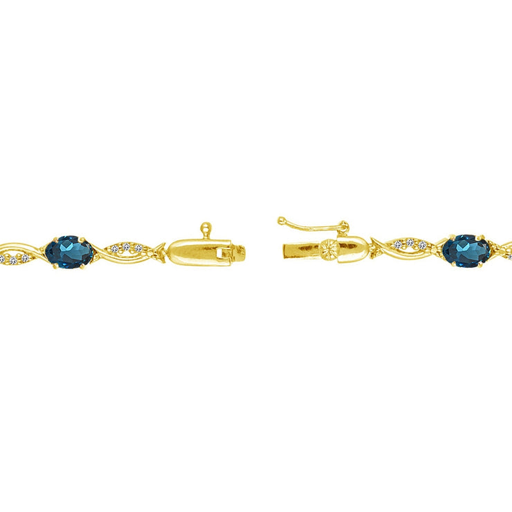 Yellow Gold Flashed Sterling Silver London Blue and White Topaz Oval-Cut Swirl Tennis Bracelet