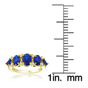Yellow Gold Flashed Sterling Silver Created Blue Sapphire and White Topaz -Stone Half Eternity Band Ring