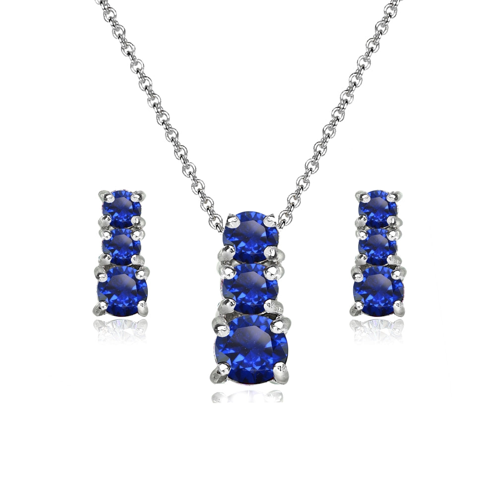 Sterling Silver Created Blue Sapphire Round Graduating Three Stone Stud Earrings & Necklace Set